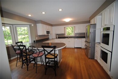 The kitchen has an island for gathering and has a 