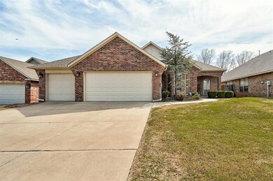 View of front of home with brick siding, concrete 