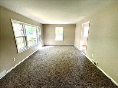 Spacious living room area with brand new carpeting