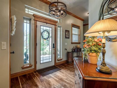 Entryway with crown molding and beautiful hard woo