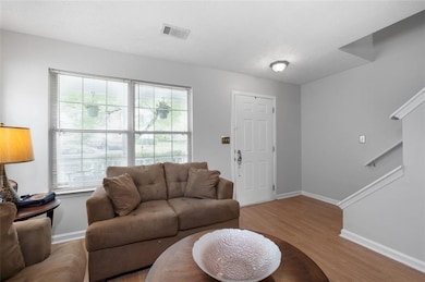 Living area featuring wood finished floors and baseboards