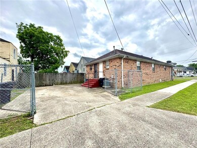 Rear access to property with gated parking.