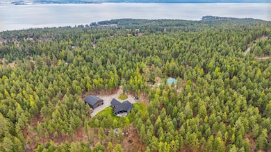 Surrounded by timber and offering space for additional dwellings, this rare property provides seclusion, beauty, and limitless opportunity just minutes from Lakeside charm.