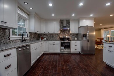 The kitchen is spacious with plenty of cabinetry and would be perfect for family gatherings. 