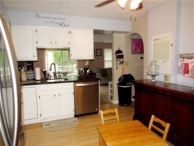 Kitchen view into open concept dining/ living room