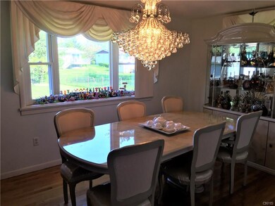 Large dining area with bright bay window and beaut