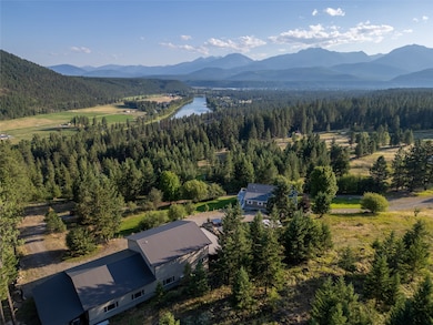 Bird's eye view of a water and mountain view and a forest