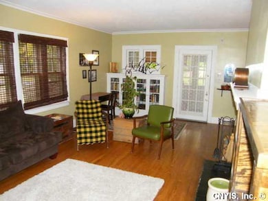 Living Room Gleaming Hardwoods and Freshly Painted