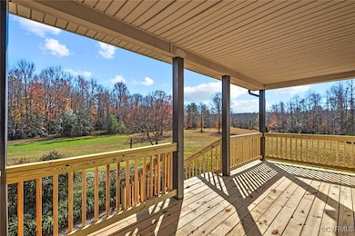 Wooden terrace featuring a lawn