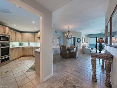 From foyer, view of the kitchen, dining area and l
