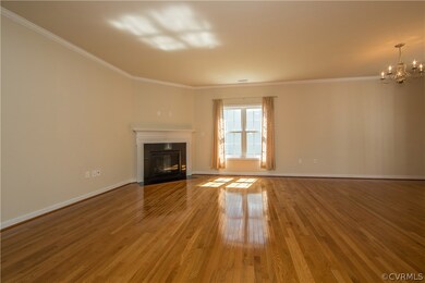 Gleaming hardwood floors, gas fireplace in great r