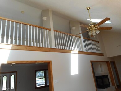 loft overlooking fam. room/kitchen
