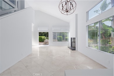 Living room with high ceilings boasting in light