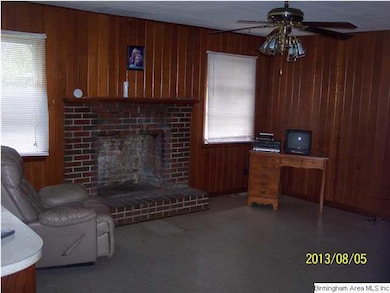 Family room with wood burning fireplace