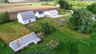 Two heated shops, horse barn and more!!