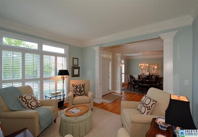 The formal living room features hardwood flooring,