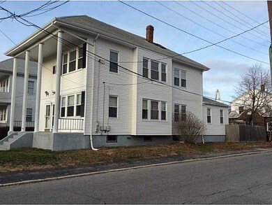 Exterior Back. Fenced yard, corner lot.
