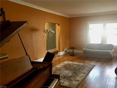 Living Room with arch to front hall.
