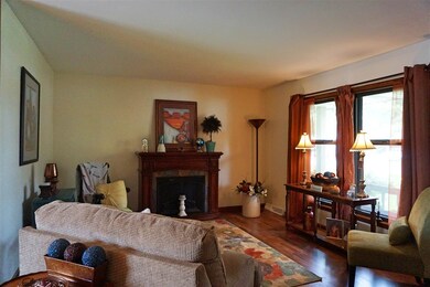 Living room on main level with hard wood flooring.