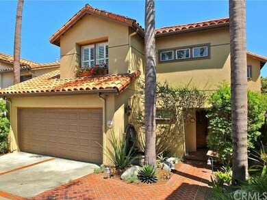 Mediterranean style home with custom paved walkway