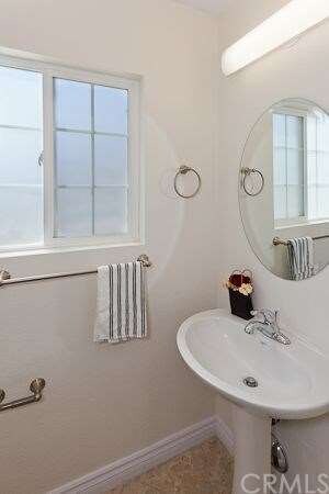 1/4 BATH NEXT TO LAUNDRY ROOM AND KITCHEN 