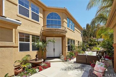 Beautiful front courtyard entry with fountain.