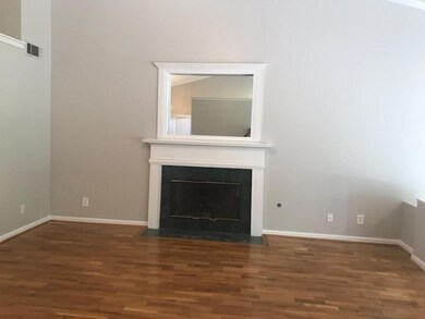 Unfurnished living room featuring a fireplace with