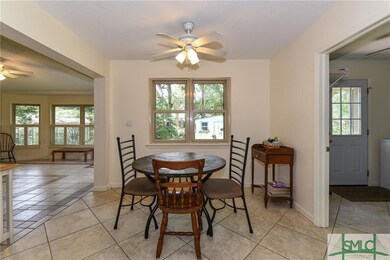Eat-in area of kitchen with Sunroom to left