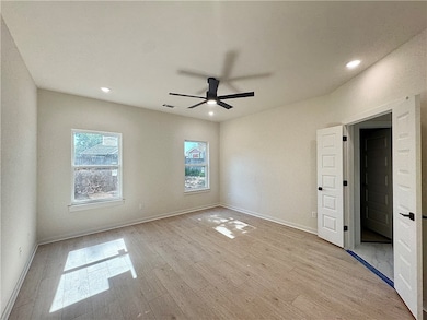 This large master bedroom is a peaceful retreat fi