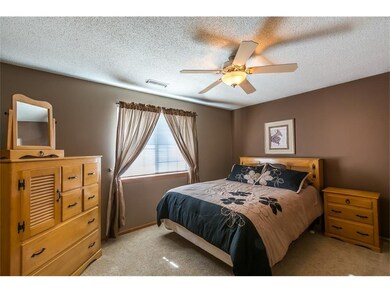 Sleep well in this master bedroom with warm colors