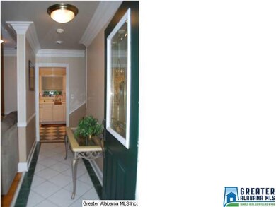 The foyer opens up into the large den.