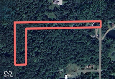 Aerial overview of property's location featuring property parcel outlined