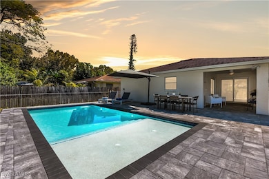 View of swimming pool with fence, a patio, a fence