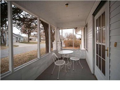 Relax on the screened-in front porch