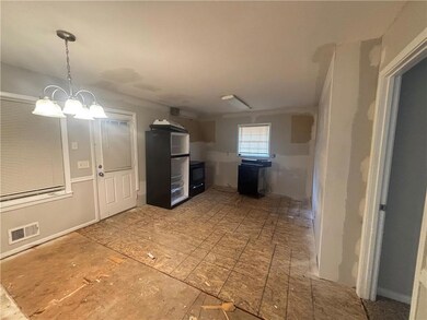 Kitchen featuring hanging light fixtures, a notabl