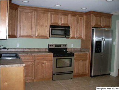 This kitchen has new custom cabinets,sink, recess 