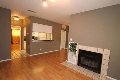Unfurnished living room with wood finished floors