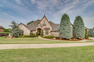 French provincial home featuring a front yard, brick siding, and a shingled roof