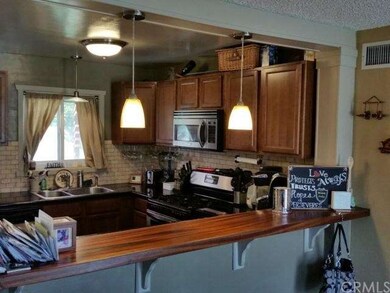 Different view of the kitchen with counter for bar