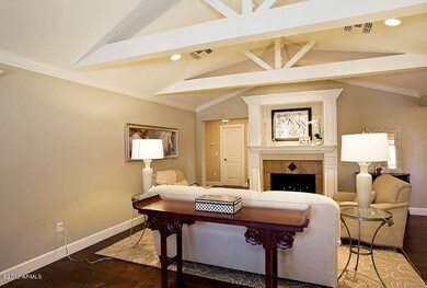 Living Rm with High Wood Beamed Ceiling
