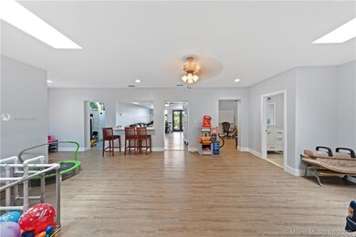 REAR FAMILY ROOM.. THE BACK PART OF HOUSE HAS BEEN REDONE WITH IMPACT ETC..