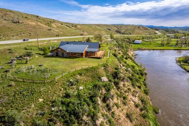 Drone / aerial view featuring a water and mountain