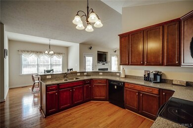 Kitchen with view of back yard and breakfast bar.