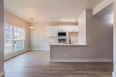 Kitchen featuring tasteful backsplash, wood finish