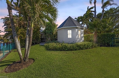 Property exterior at dusk with a lawn