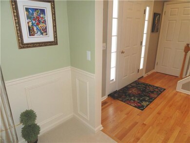 Other Foyer / Living room with chair rail, new car