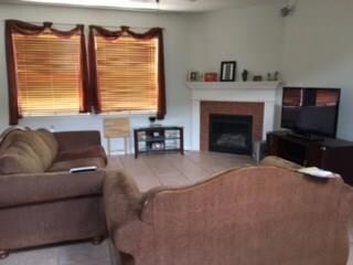 Family Room with Fireplace and Mantel/Tile Floors.