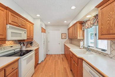 Kitchen is located at the front of the home with access to garage