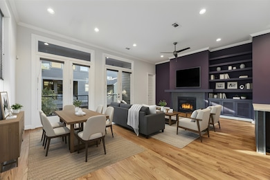Digitally staged living area showcasing the fireplace