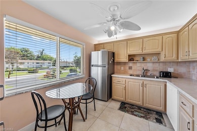 Kitchen featuring light tile patterned flooring, s
